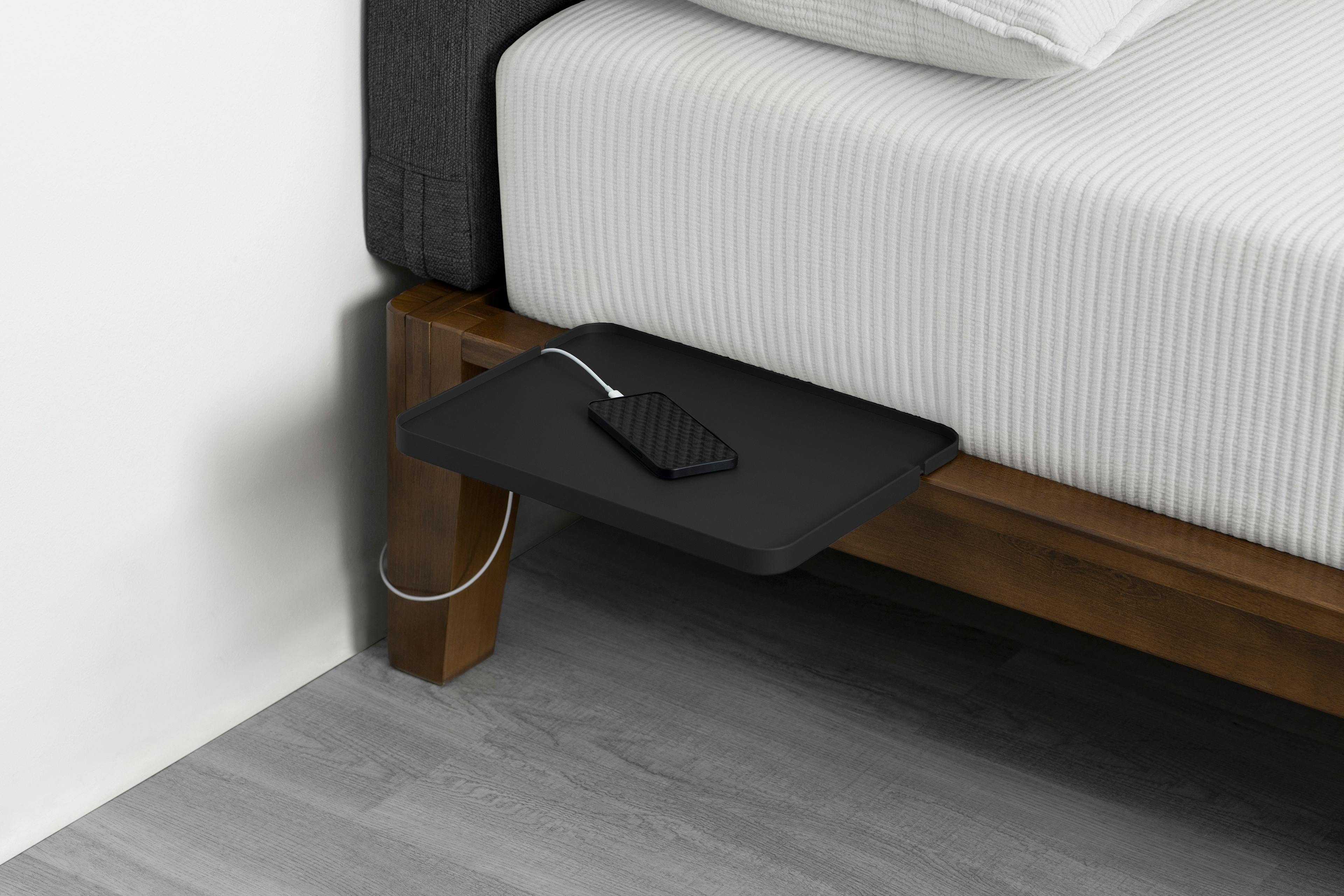 The Tray in Matte Black Color Displayed with a Phone, Perfect for Bedside Storage